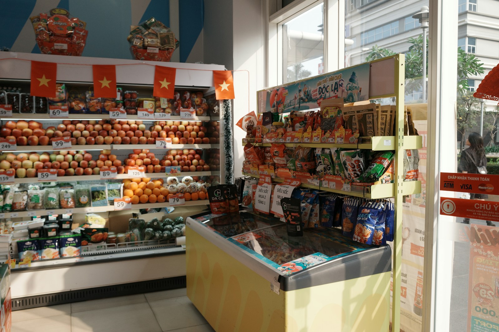 A grocery aisle displaying fresh produce and packaged foods